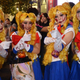 Women wear Sailor Moon outfits and gory makeup.
